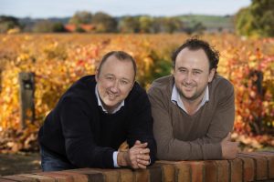Cameron and Allister with the Command vineyard in autumn